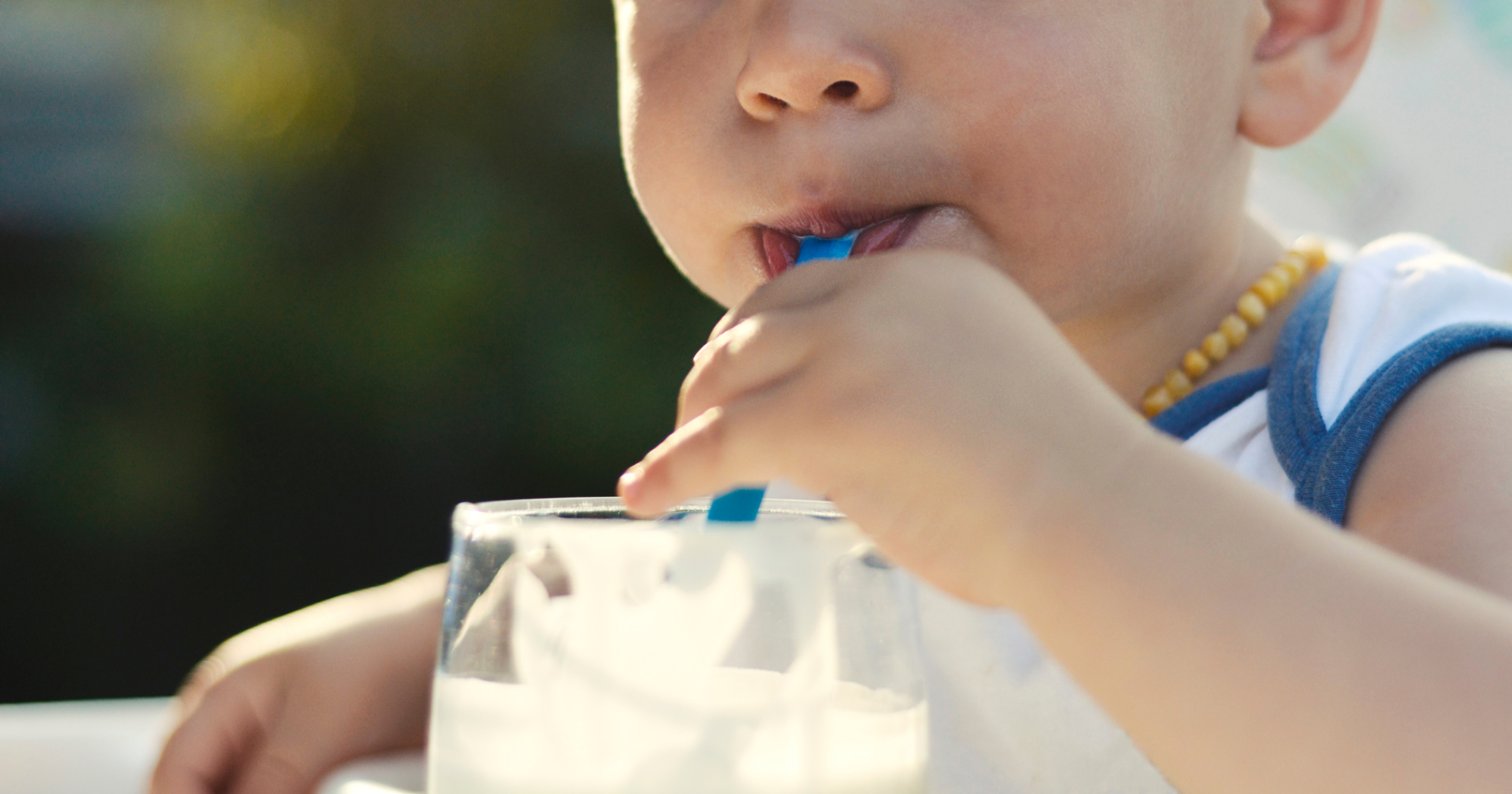 toddler drinking from a straw